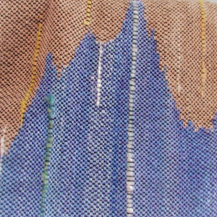 Detail of hand dyed, hand spun, hand woven scarf in blue and sandy brown inspired by the Cornish Coast
