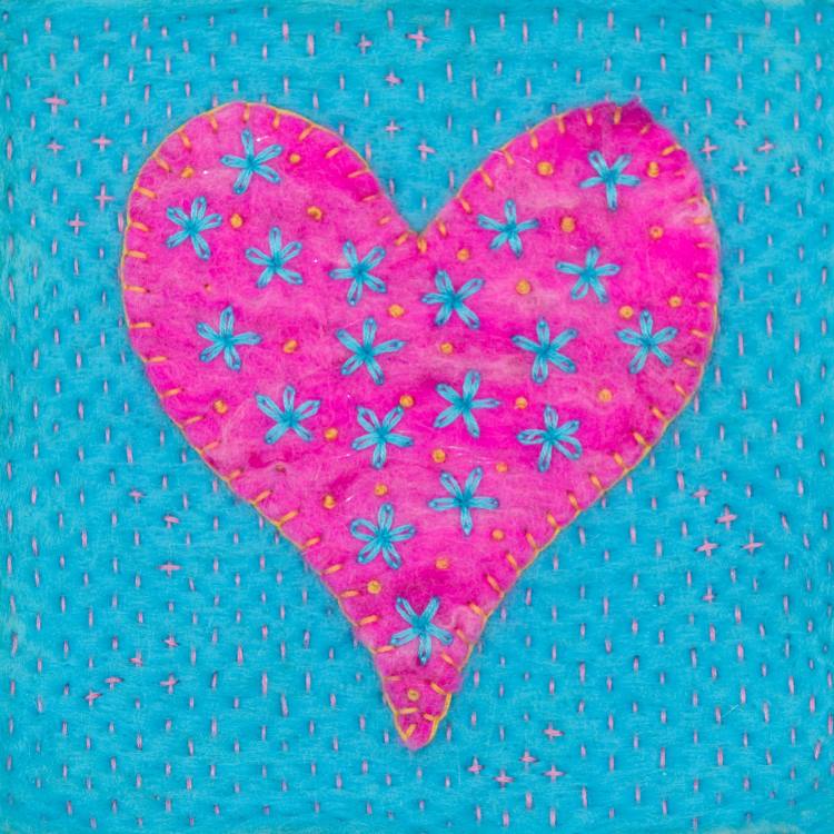 Greetings card image of a bright pink heart blanket stitched with golden yellow thread onto a bright turquoise felt background. The heart is embroidered with turquoise flowers and golden yellow French knots. The background is embroidered with tiny pink running stitch.