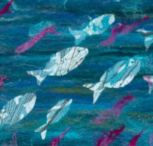 Greetings card design with teal felt background, white and turquoise nuno felt silk fish and bright pink wool locks.