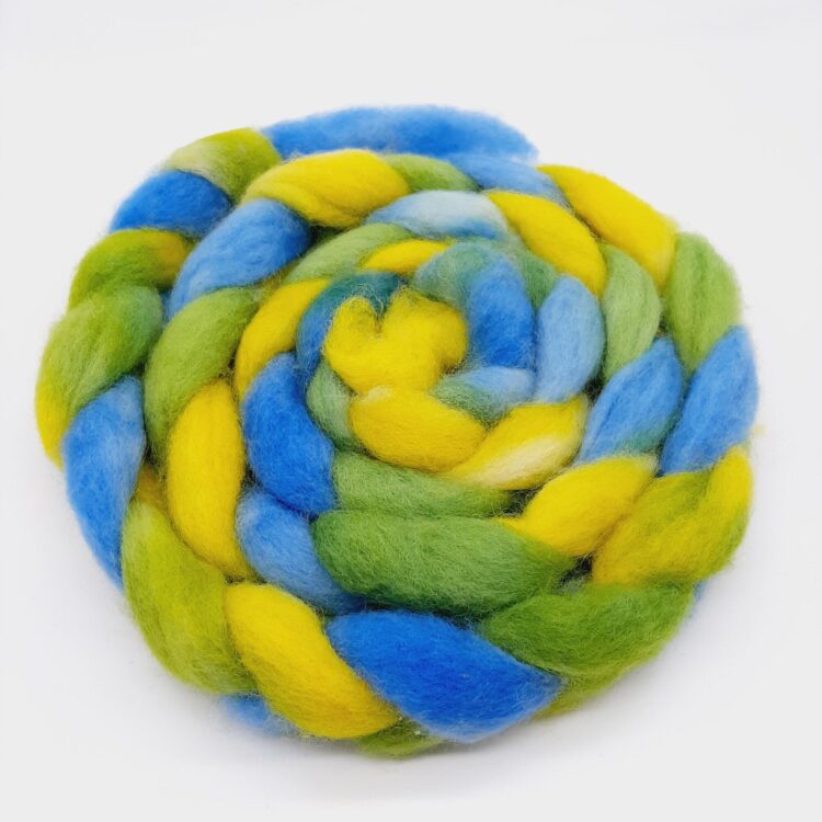 A braid of hand dyed Cornish Romney roving in blue, green and yellow.