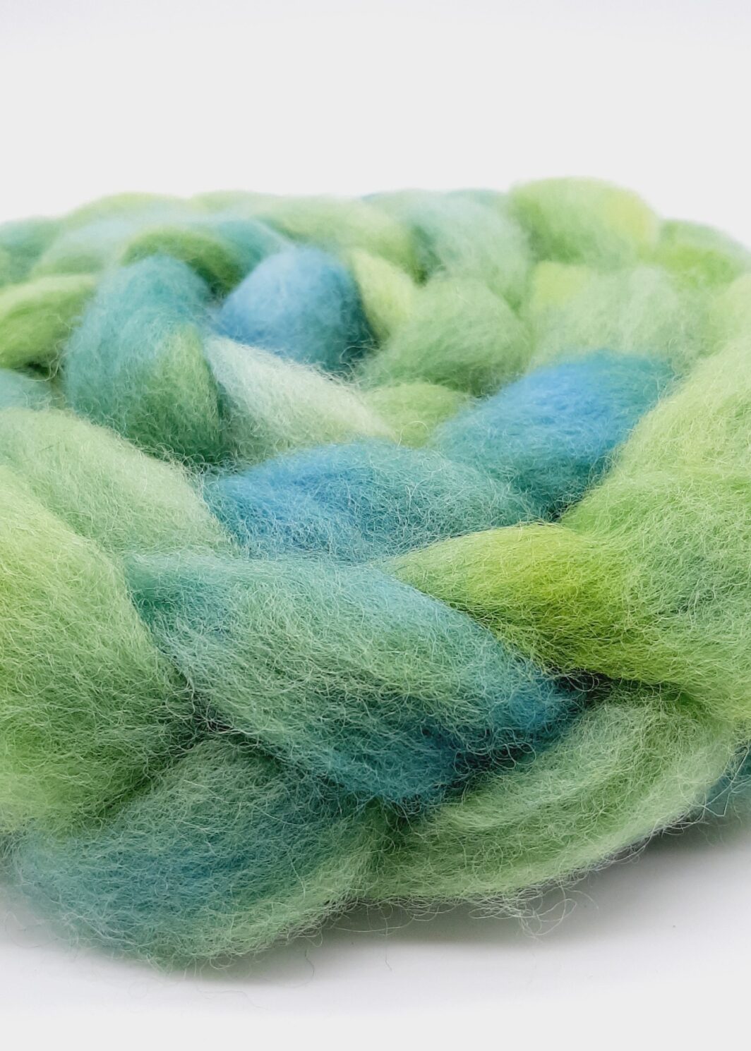 A braid of Cornish Romney roving hand dyed in beautiful shades of green.