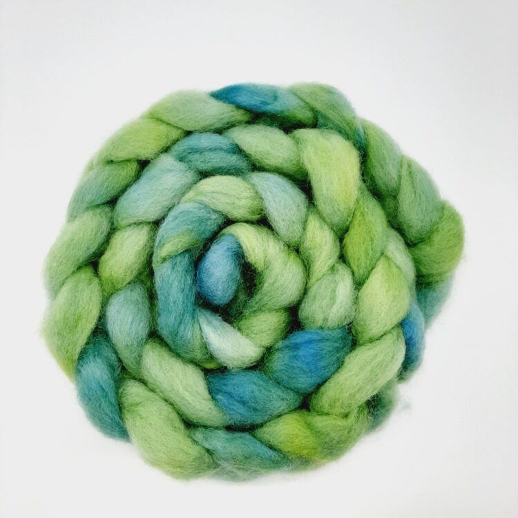 A braid of Cornish hand dyed Romney roving in shades of green