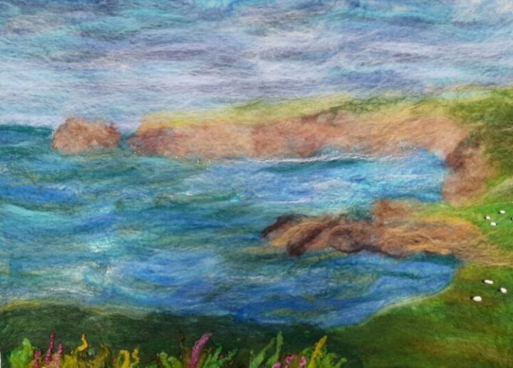 Wet felt picture of the North Cornish coast showing sea, cliffs and sky.