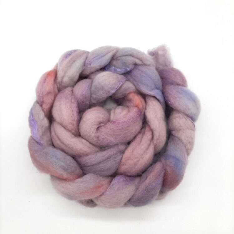 A braid of hand dyed Bluefaced Leicester and silk in shades of purple with a rosy blush