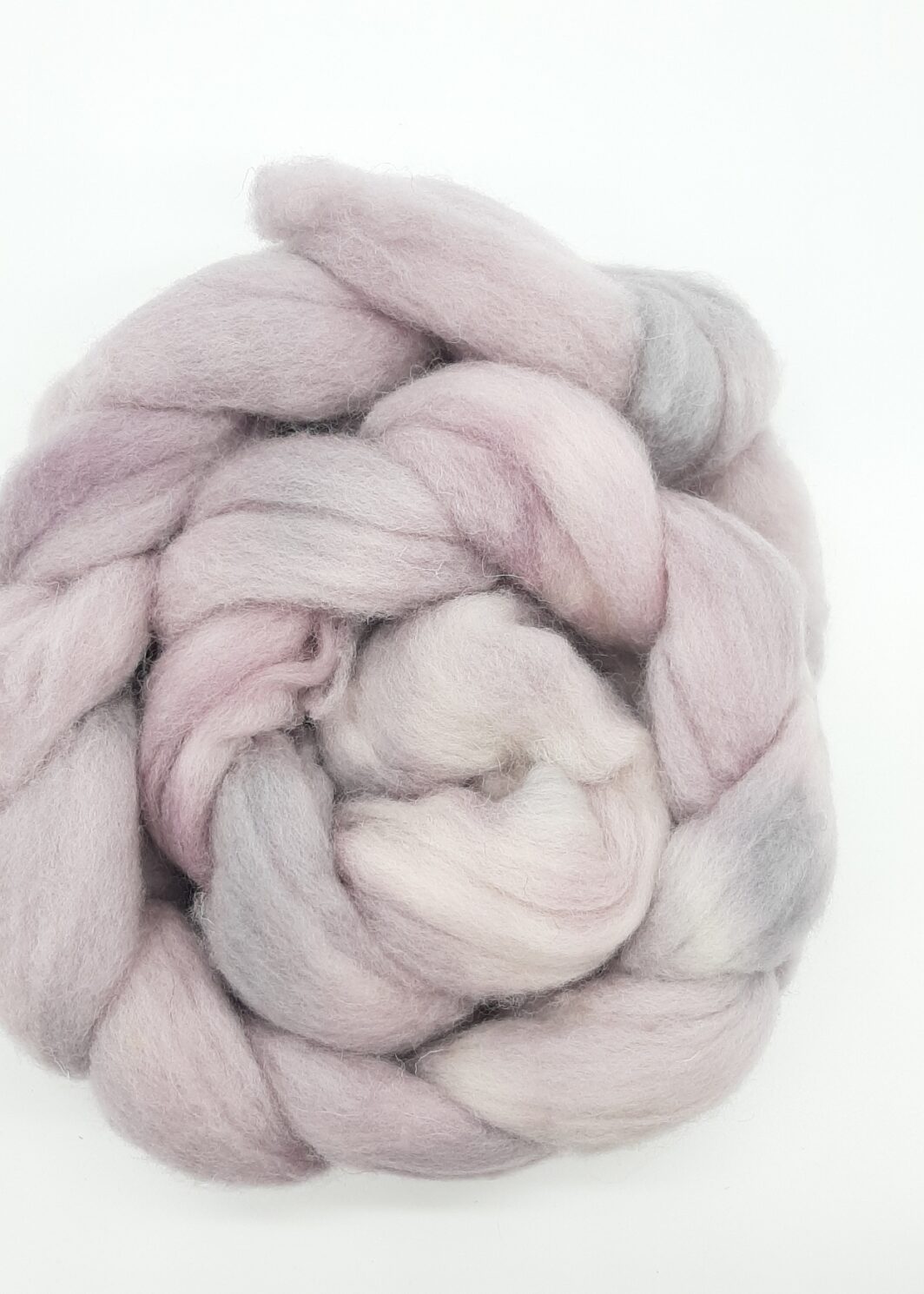 A hand dyed braid of shetland fibre in pale purples and greys