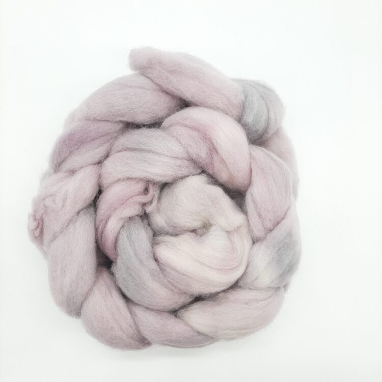A hand dyed braid of shetland fibre in pale purples and greys