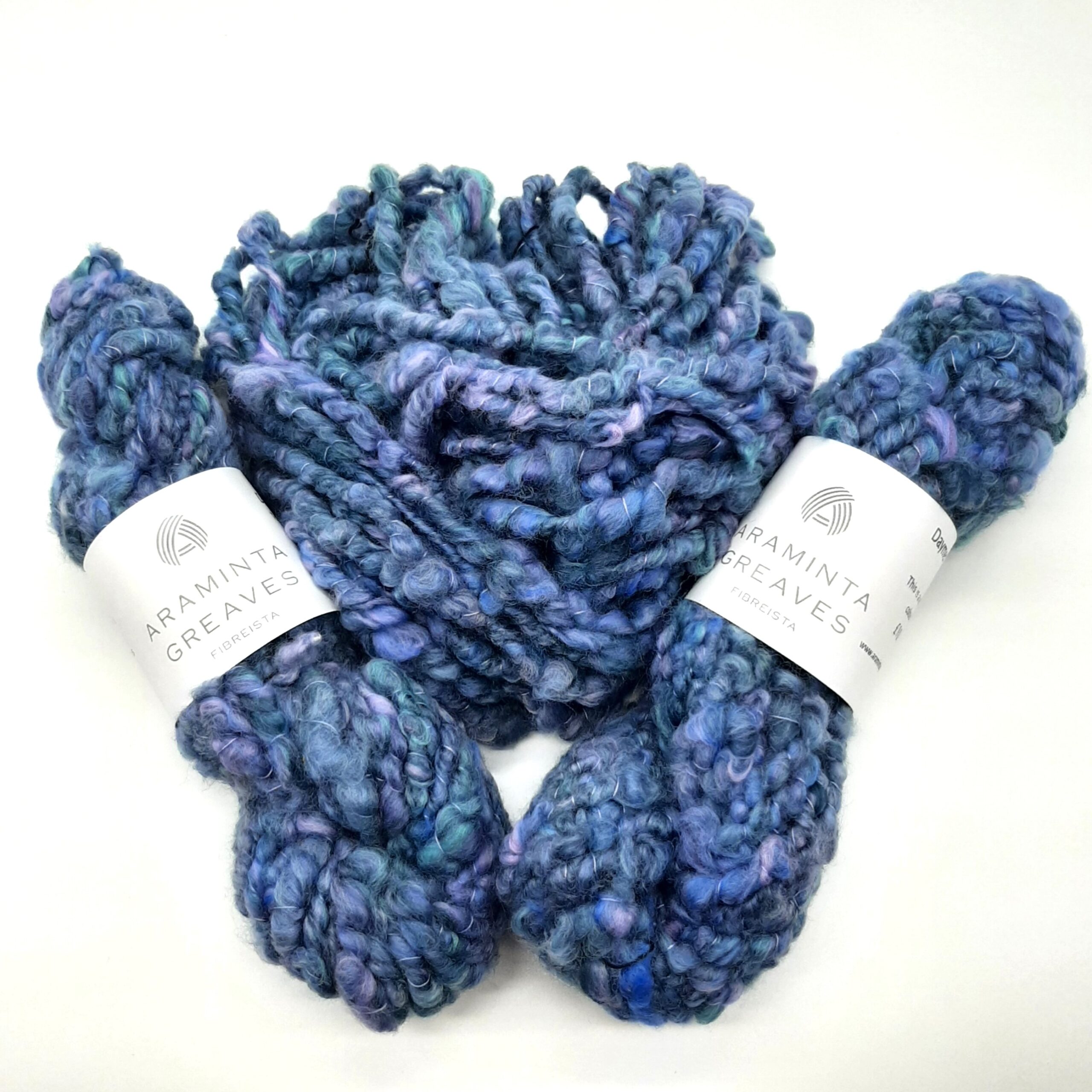 Daymer Storm handspun corespun merino yarn in blues with a hint of lilac.