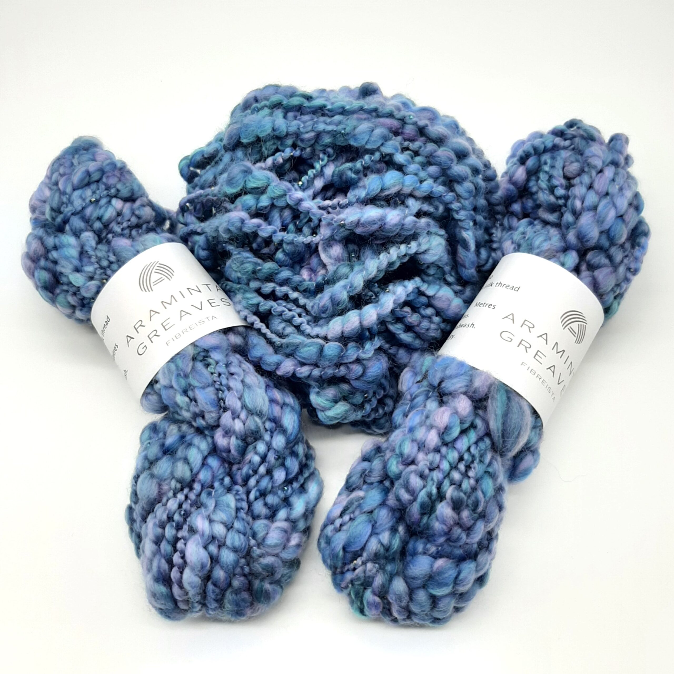 Daymer Storm handspun beaded merino yarn in blues with a hint of lilac.