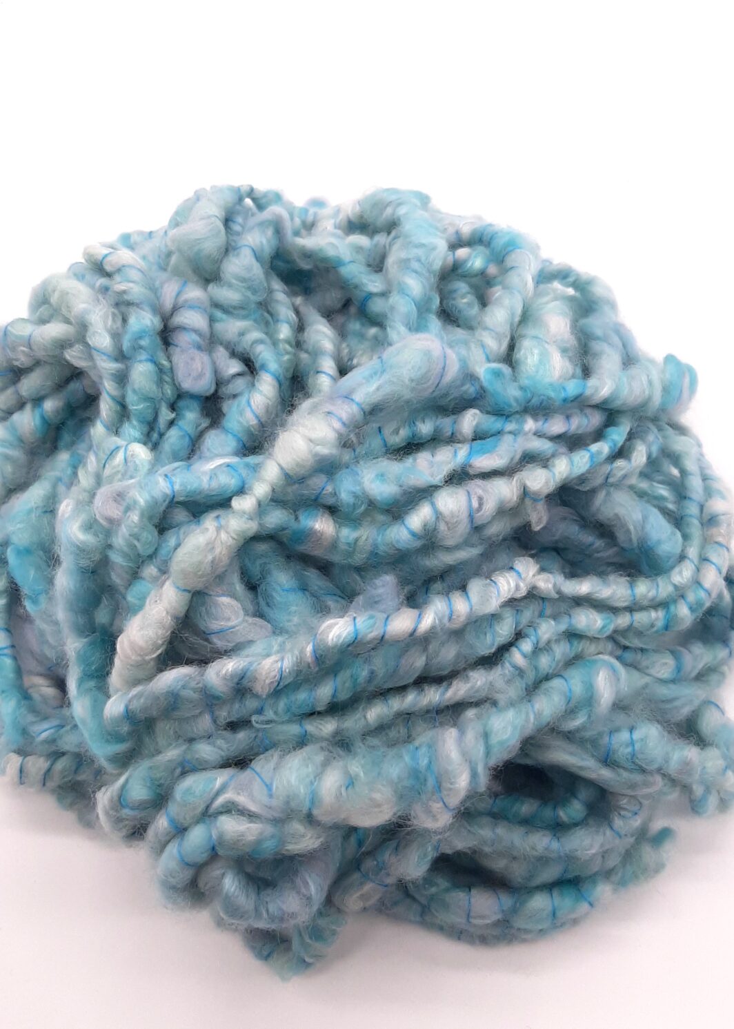 Trevone Foam, handspun corespun merion and silk yarn in pale blue, turquoise and grey.
