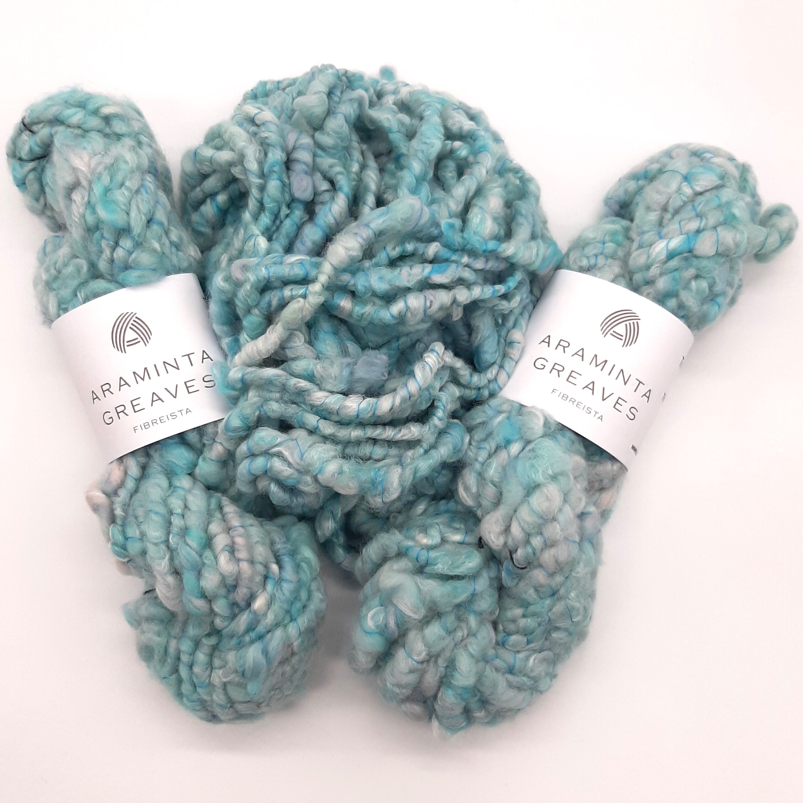 Trevone Foam, handspun corespun merion and silk yarn in pale blue, turquoise and grey.