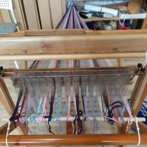 The back of a Saori loom showing the warp tied on
