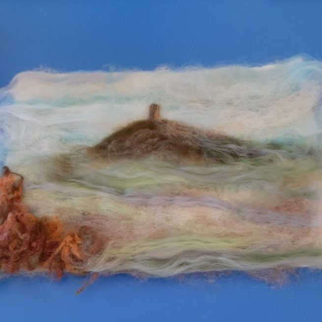A needlefelt picture depicting Glastonbury Tor in beautiful, misty, pastel colours
