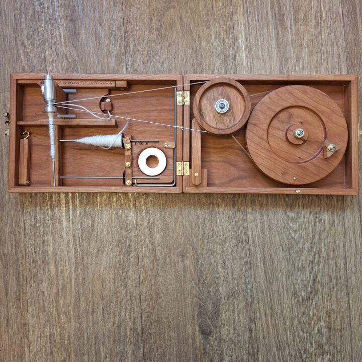 open cherry wood book charkha